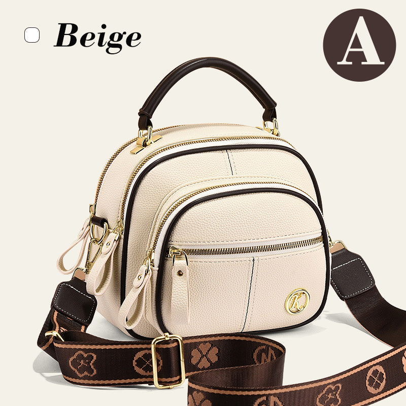 Bolso clásico con múltiples compartimentos y bandolera ancha y ajustable