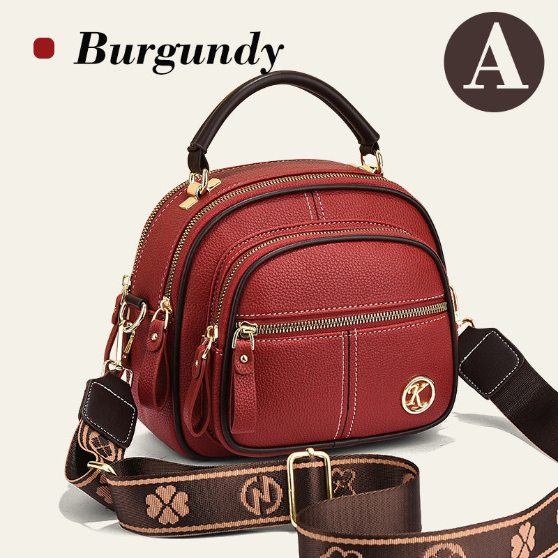 Bolso clásico con múltiples compartimentos y bandolera ancha y ajustable